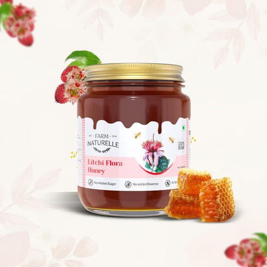 Pure litchi honey in glass jar with golden texture