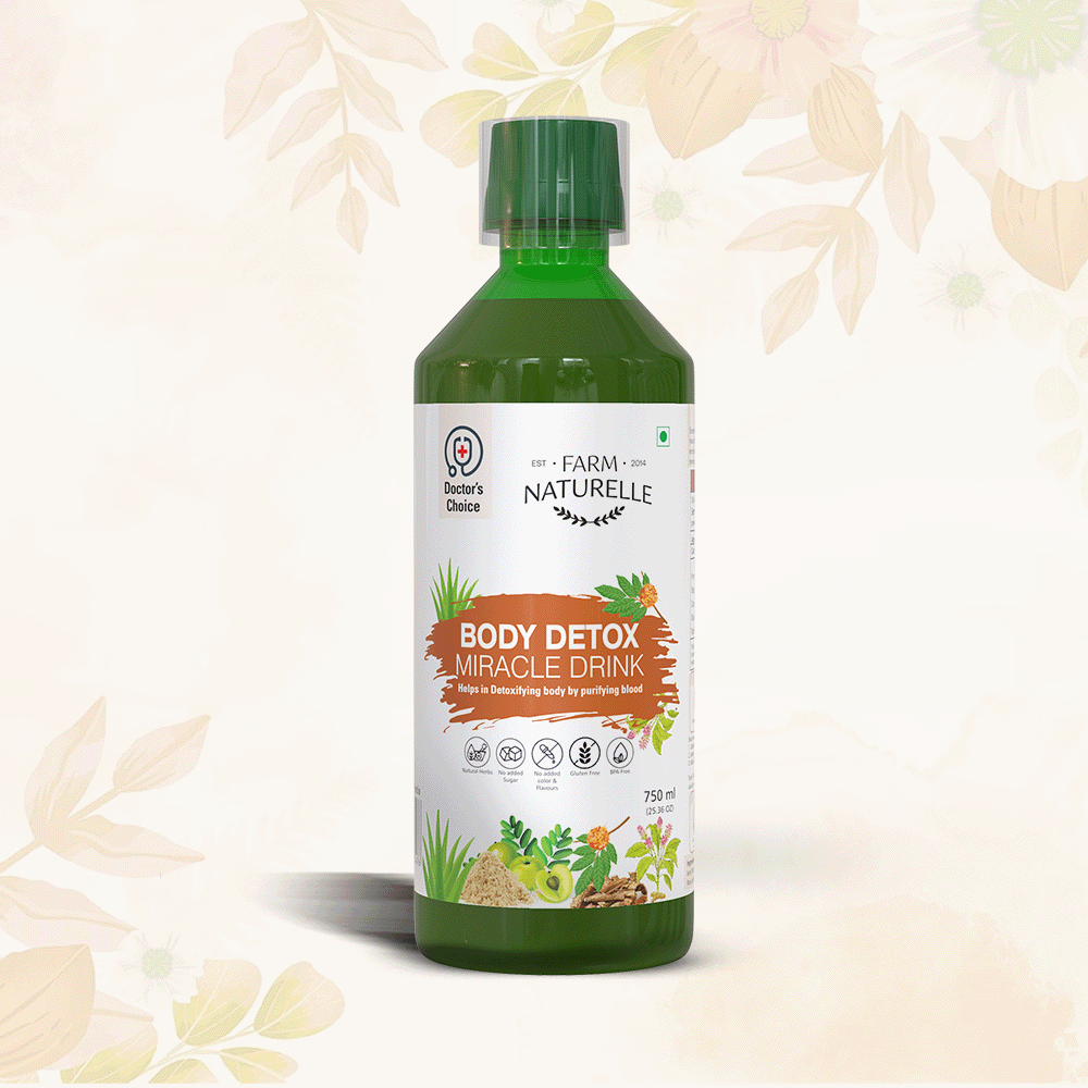 A vibrant detox shot in a glass with fresh ingredients like ginger and lemon